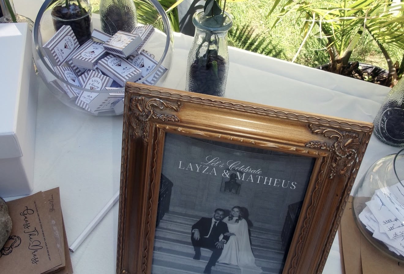 Framed Let's Celebrate Layza and Matheus sign on the welcome table
