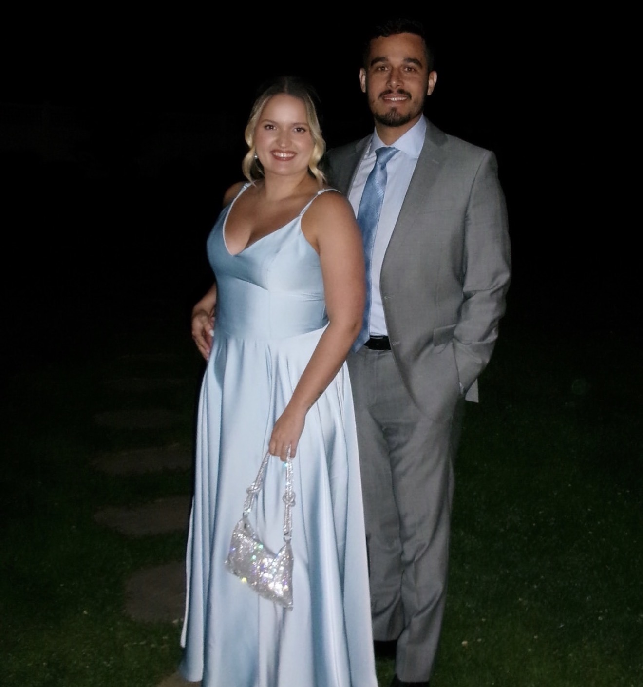 Matheus and Layza dressed up together on a warm evening